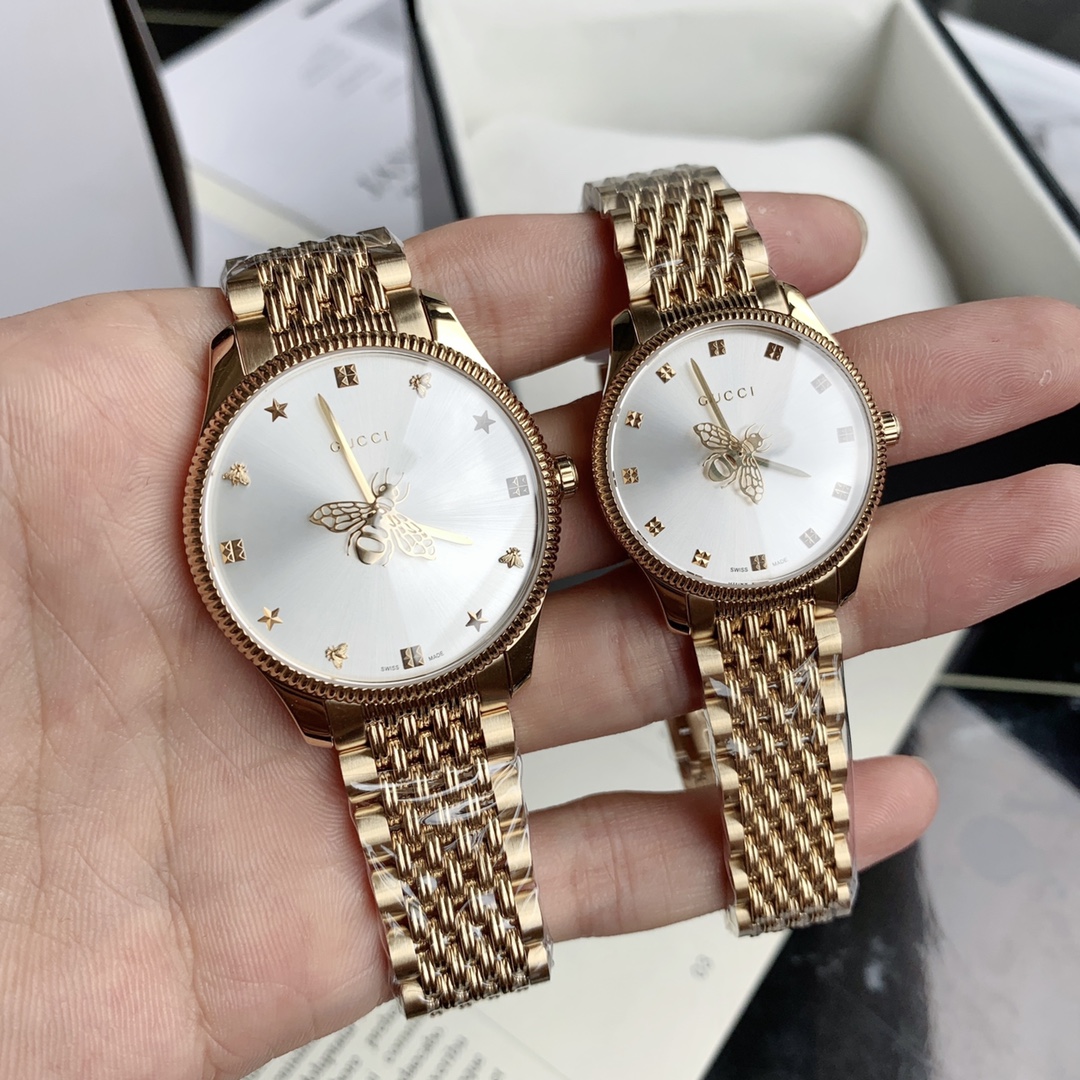 New Gucci couple watches. The Gucci G-Timeless collection of classic stainless steel watches features a classic sensual design that combines sunray textured dials and a cleverly designed bee-patterned second hand. Stainless steel case, silver sunray patte