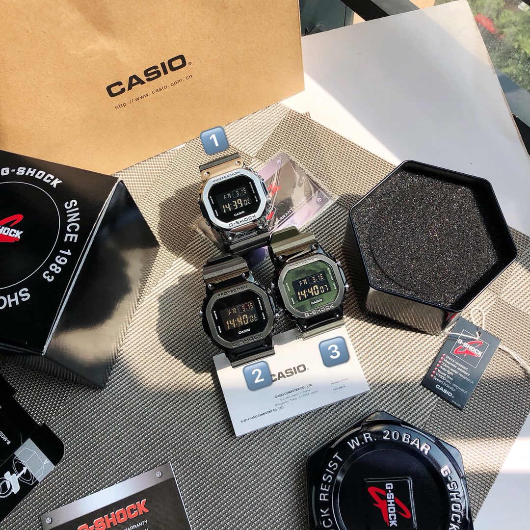 ??120 New GM-5600 and GM-5600B models both feature resin and the same design as the G-SHOCK signature square dial of the 5600 series, with stainless steel bezels. While providing a superior metallic finish, the case and strap are made of resin, giving the